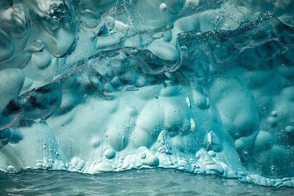 Alaska-Tracy Arm-Close-up of deep blue-green iceberg floating near face of South Sawyer Glacier